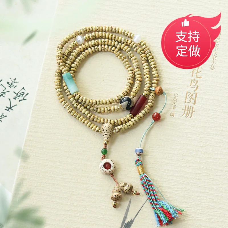 Natural golden seed star-moon bodhi multi-loop bracelet with dzi beads, , southern red agate, glass, and chalcedony accesso