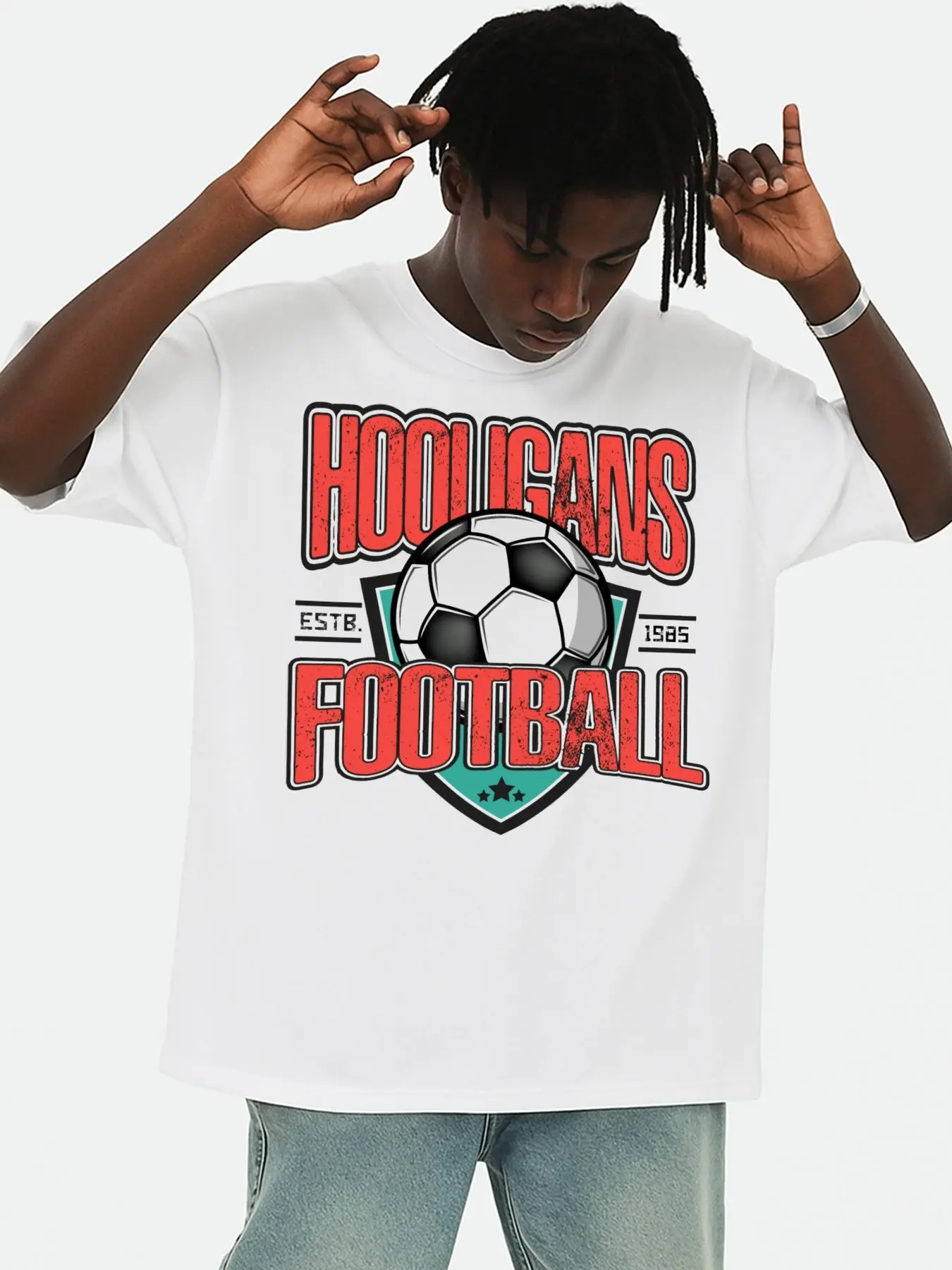 Men's Retro Hooligans Football T-Shirt, White, Featuring a Short Graphic Design. This Fun and Playful T-Shirt Is Perfect for Year-Round Wear, Offering a Stylish Summer Look. It Is Made from Comfortable, Stretchy Fabric and Offers a Loose Fit.