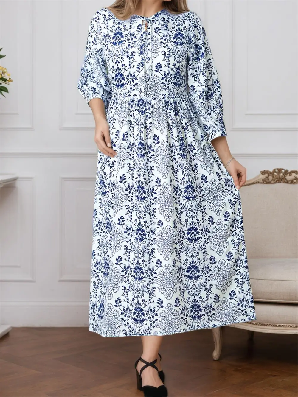 Elegante a-lijnjurk met bloemenprint en lange mouwen voor herfst en winter met strikdetailleerde mouwen