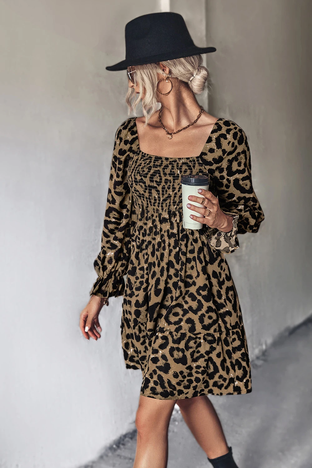 

Classic leopard print long sleeved shirt with a square neckline and a backless jumpsuit mid length skirt