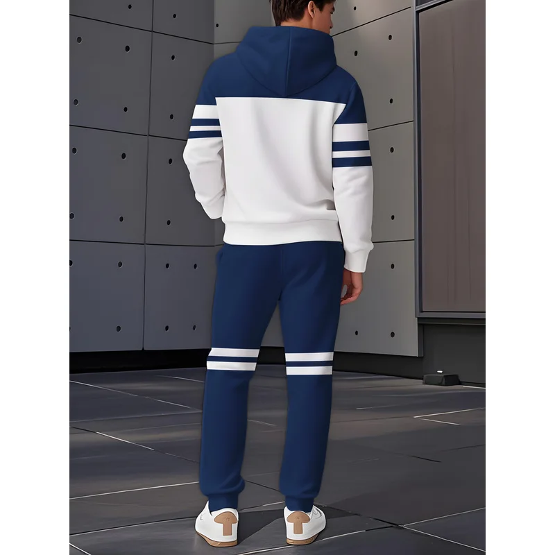 The Men'S Casual Sportswear Set Includes A Hooded Sweatshirt And A Pair Of Blue And White Color Block Designed Pants