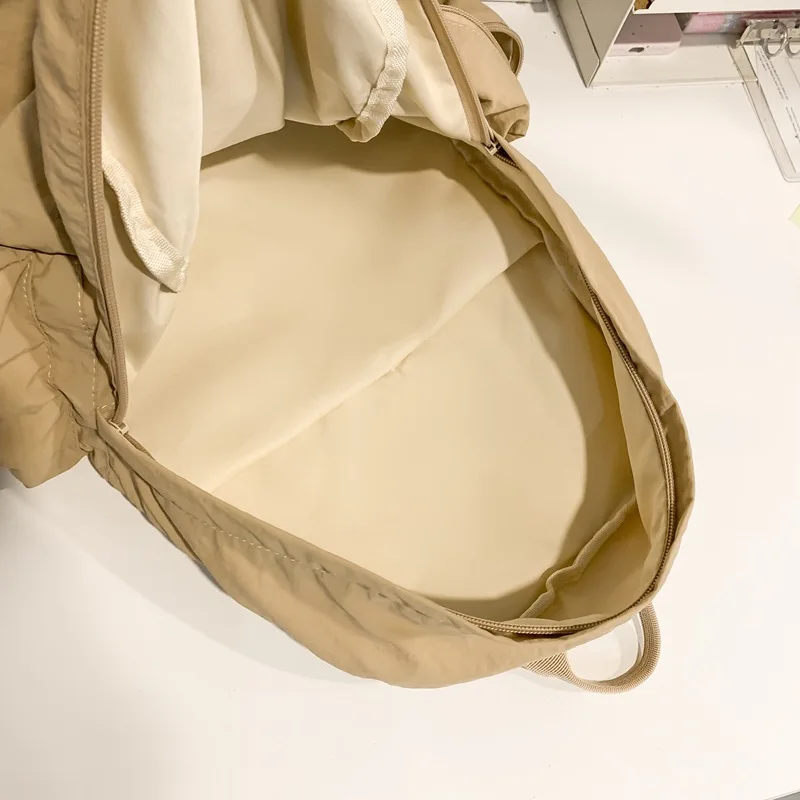 Korean Minimalist 2025 New Solid Color Large Capacity Lightweight Backpack Student School Bag Travel Dual Purpose Unisex Design