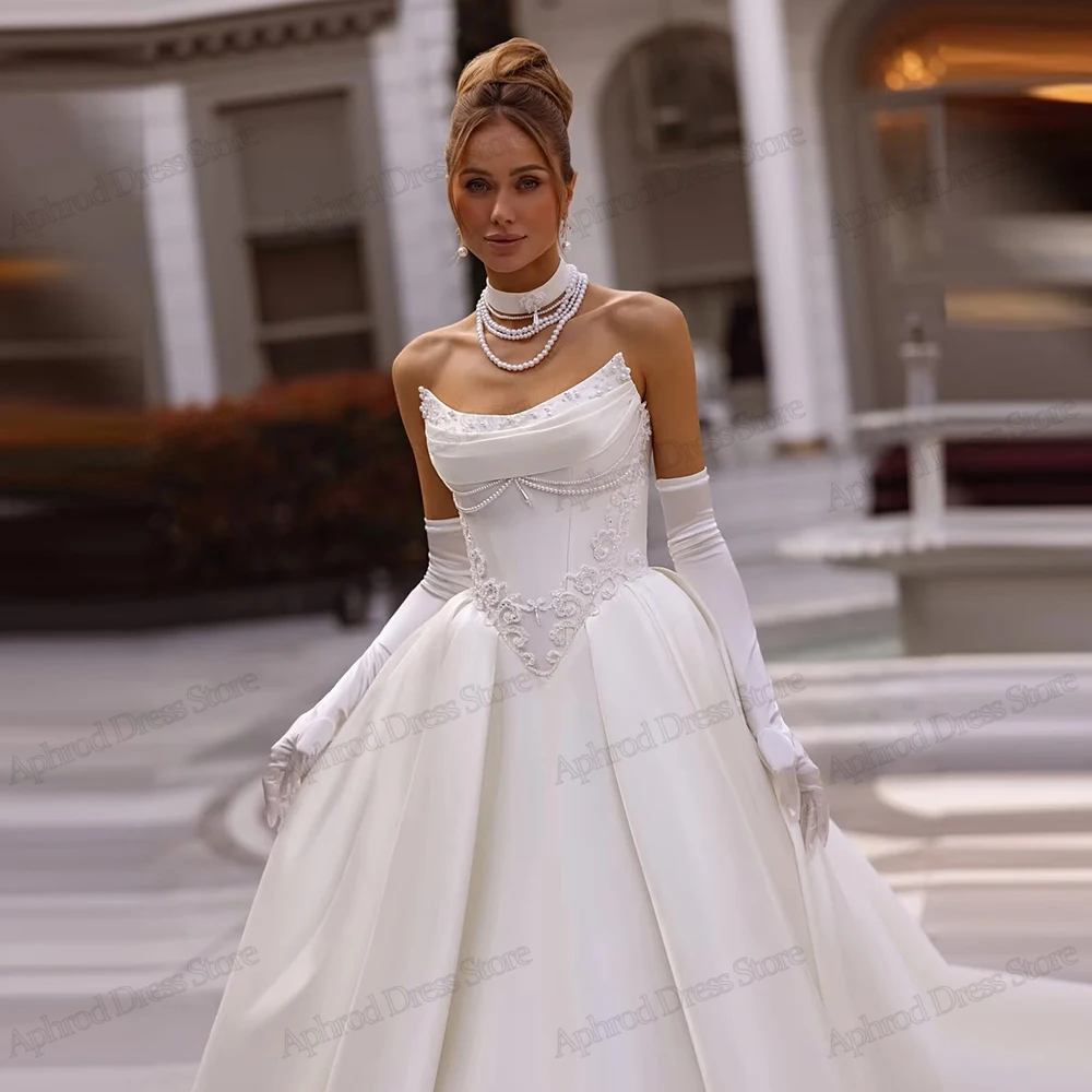 ชุดแต่งงานที่งดงาม ชุดเจ้าสาวที่มีเสน่ห์ ประดับด้วยลูกปัด แอพพลิเคชั่น คอเรือ เสื้อคลุมแขนกุด วินเทจ เวสติโด เด โนเวีย แบบสั่งตัด