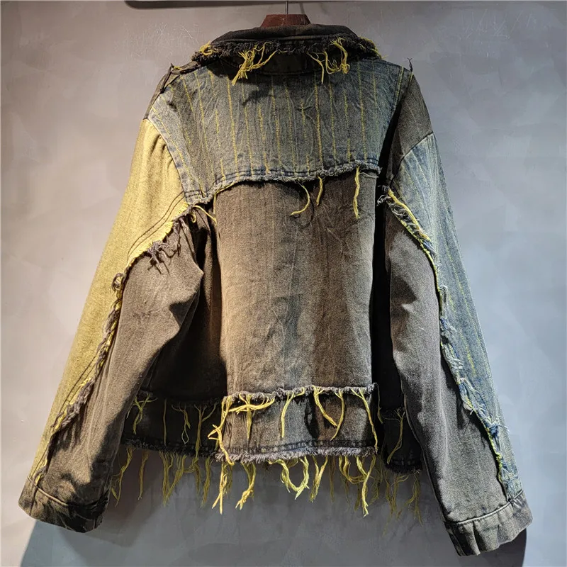 

Heavyweight patchwork denim jacket with raw-edge details and a distressed wash. Edgy, vintage street-style for fall.