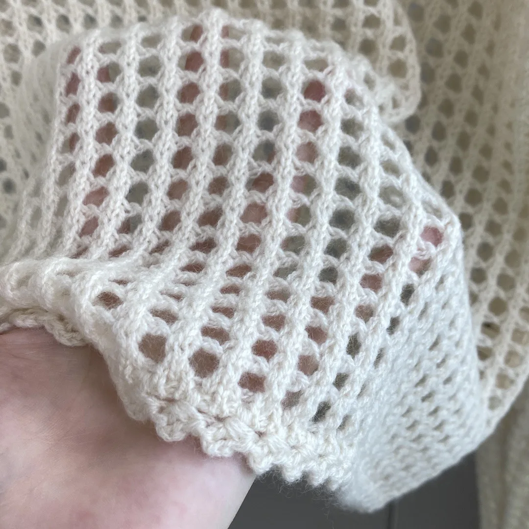 25 outono e inverno novo cashmere com capuz oco malhas femininas manga longa solta camisola superior