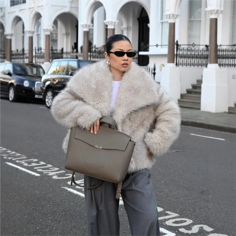 

A new women's top with mixed fur and fluffy coat embossed plush clothing