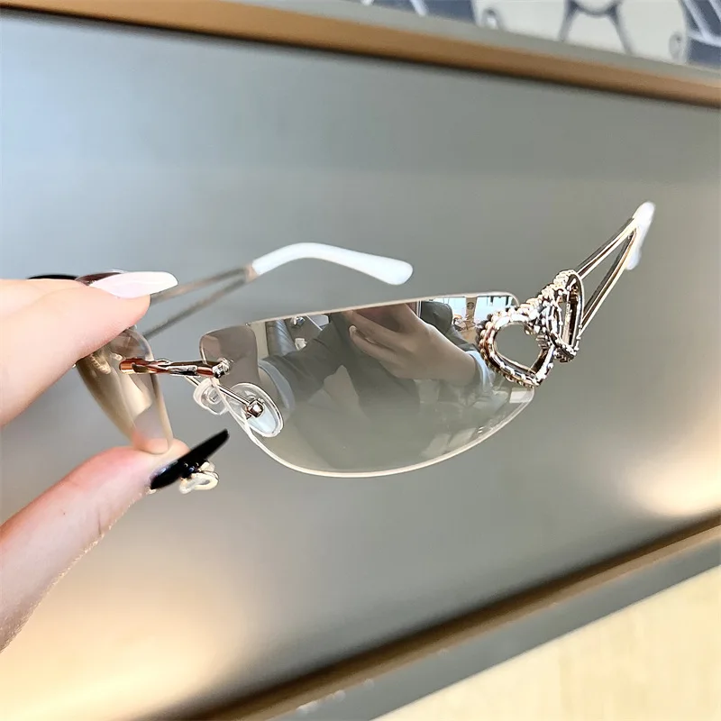 New Oval Cat Eye Frameless Mercury Sunglasses With Heart-Shaped Metal Hollow Out Y2K Sweet and Cool Hot Girl Sun Glasses - view 2
