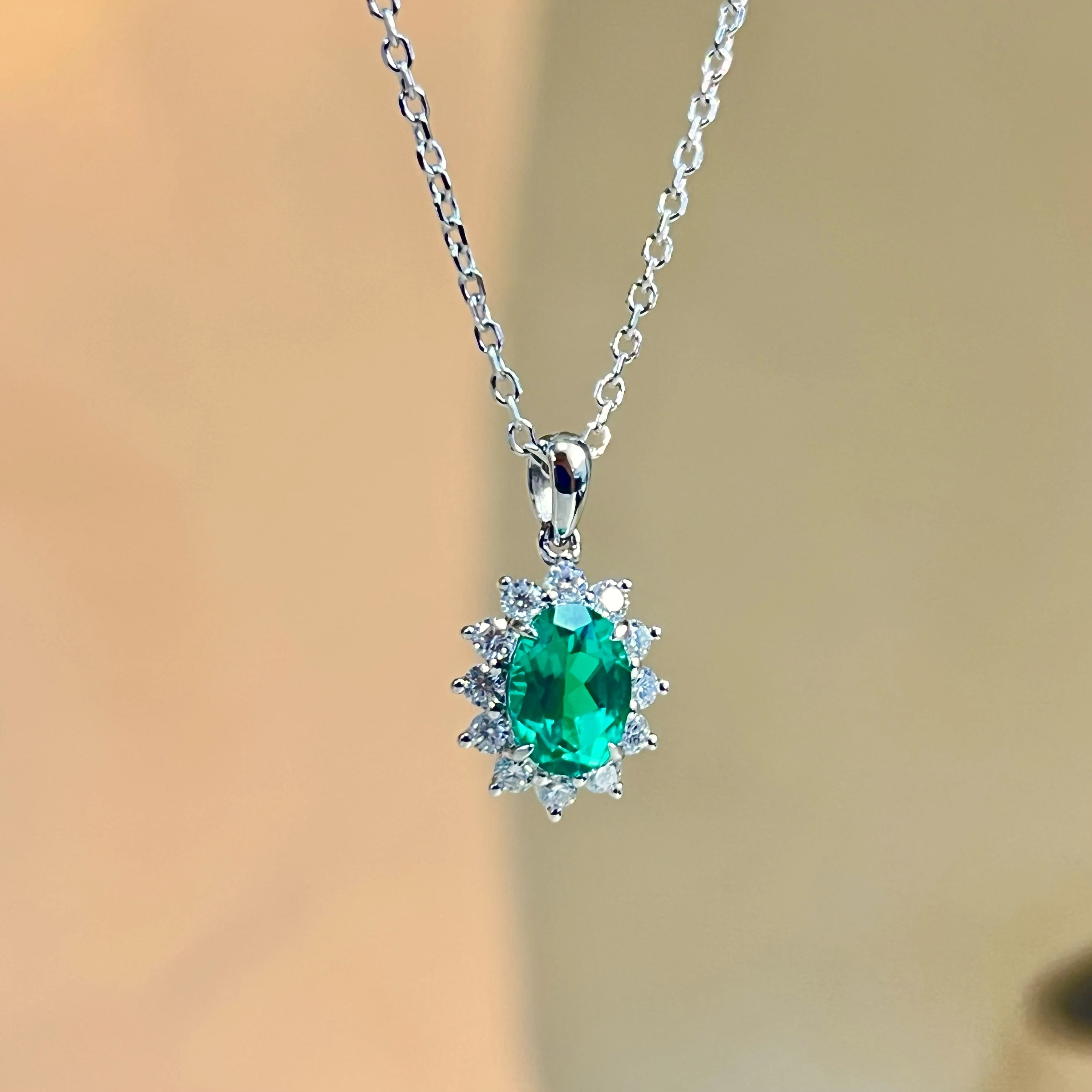 S925 sterling silver, cultured wood, green emerald necklace with classic everyday surround-set diamond pendant design.