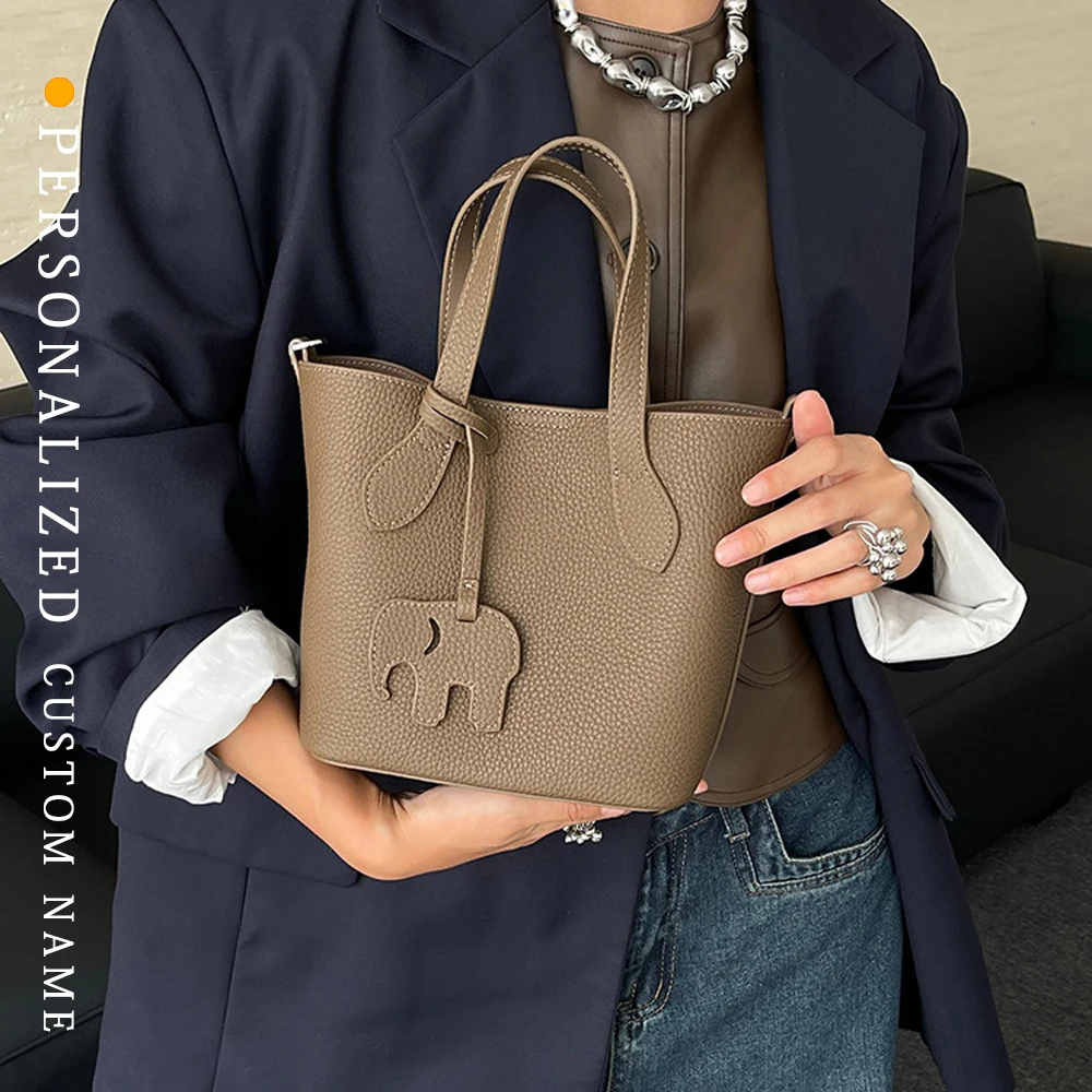 

Simple and niche women's hand-held bucket bag fashionable high-end commuter leather one-shoulder crossbody bag custom