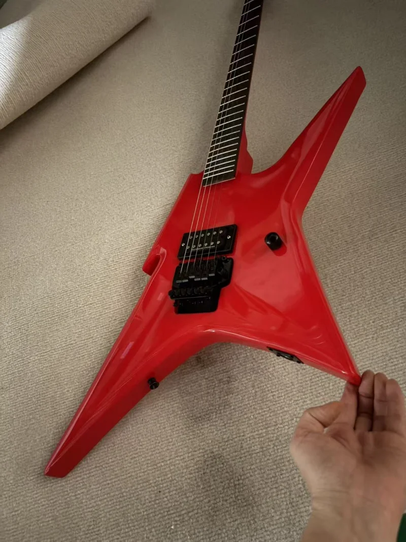 A large red lightning-shaped 6-string guitar with rosewood fretboard, black tremolo bridge, high-gloss finish, free delivery