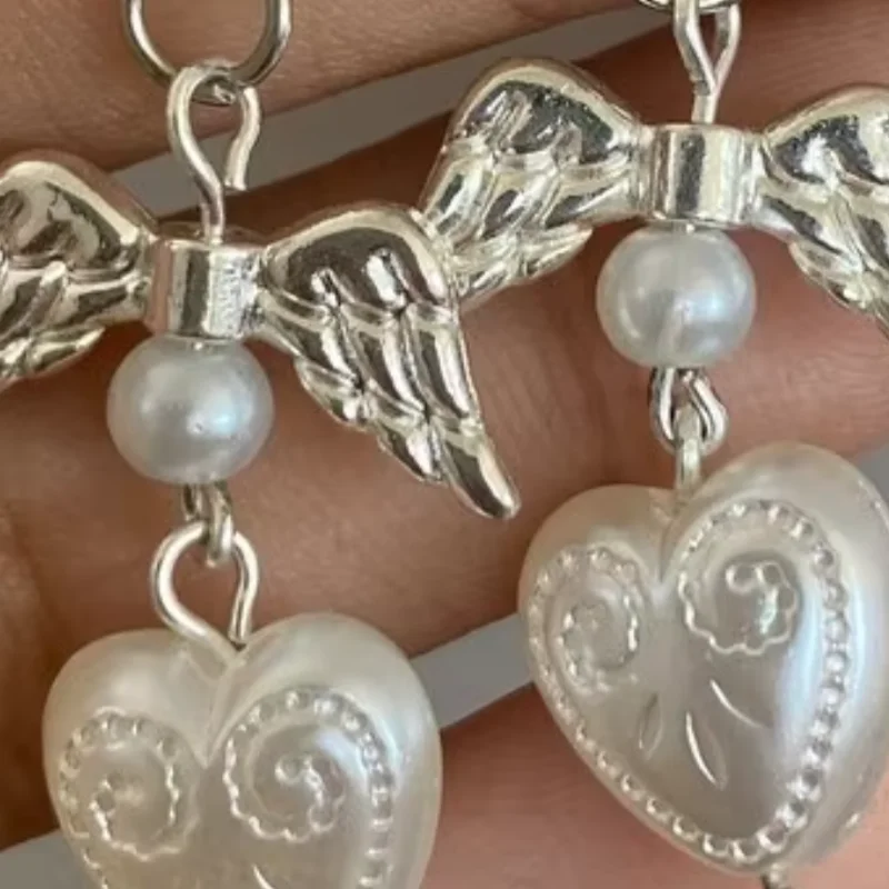 white coquette pearl angel earrings