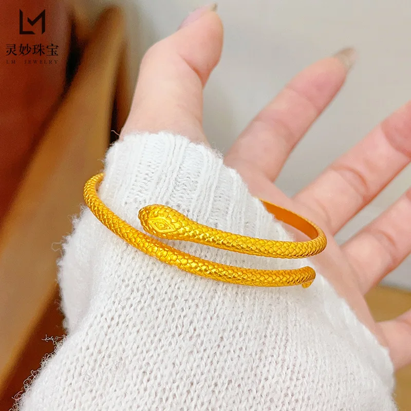 

Women's 24K Gold (AU999) Vintage Snake Open Cuff | Gold-inlaid snake eyes, hammered coils with rotatable tongue clasp