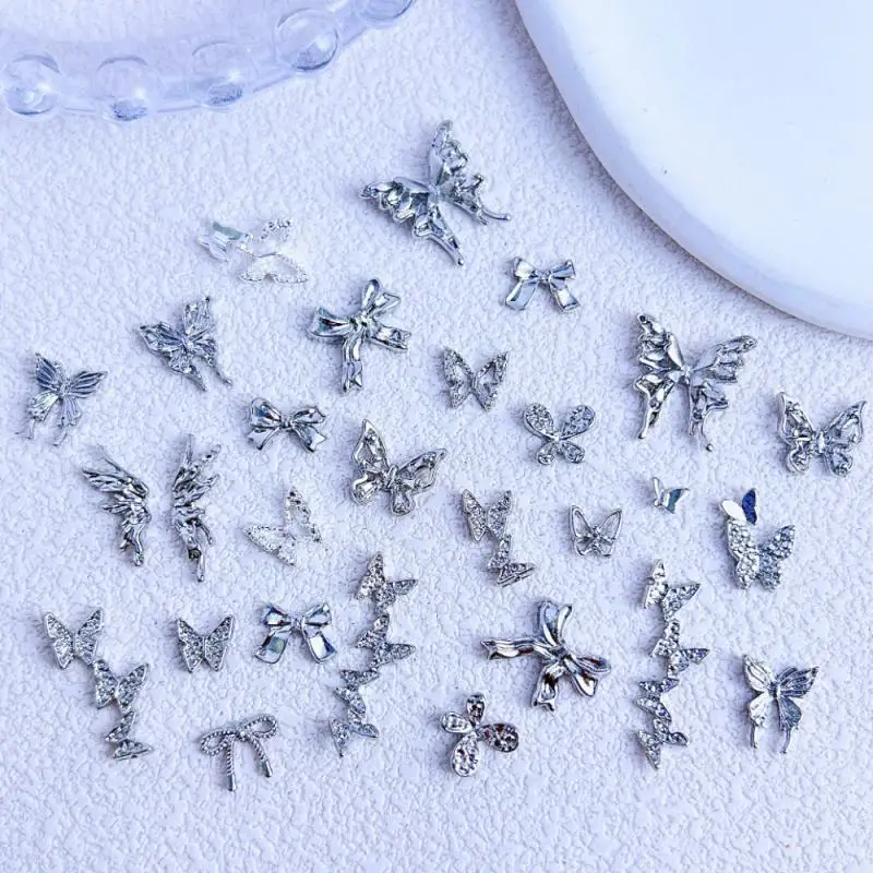 

20Pcs Metal Alloy Hollowed-Out Butterfly Nail Art Decorations Minimalist Silver Bows Wings Nail Charms for Making DIY Cool Nails