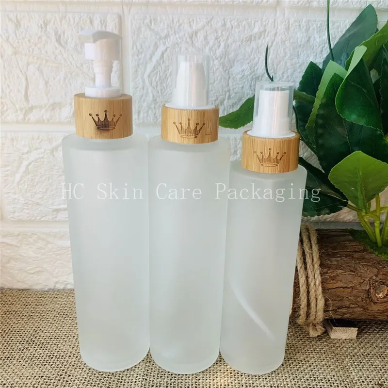 

sale Childproof cap clear frosted flat shoulder essential oil cosmetics bamboo glass lotion bottle，homehold lotion glass bottle