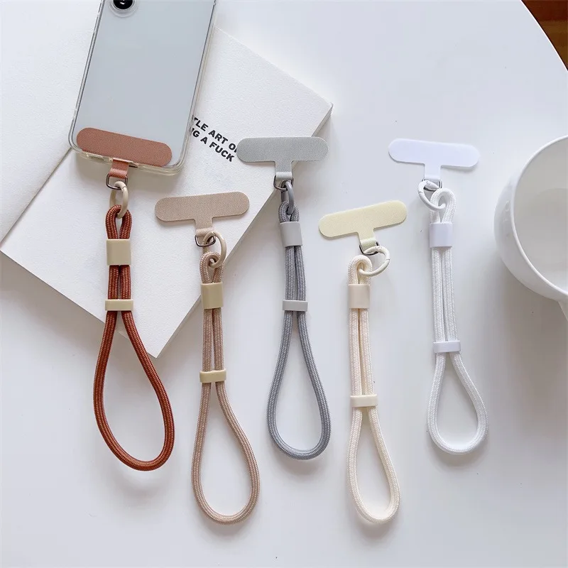 Universele verstelbare polsband voor mobiele telefoon, kort met zelfsluitend anti-drop-ontwerp, duurzame polyester INS-telefoonriem