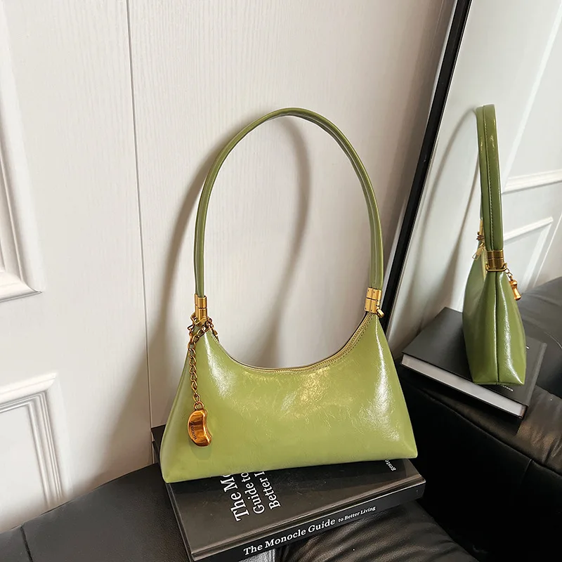 

New summer women's luxury solid color oil wax leather crescent shoulder bags Fashion designer commuting handbags and pendant bag