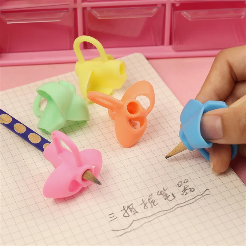 50PCS  Primary school student pen holder writing correction device soft rubber pencil writing correction posture silicone sleeve