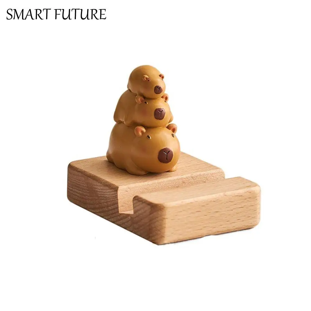 

Фигурка Модель Капибара Держатель для телефона Поддержка Декор стола Капибара Подставка для мобильного телефона Деревянная кукла из ПВХ Капибара Кронштейн для мобильного телефона