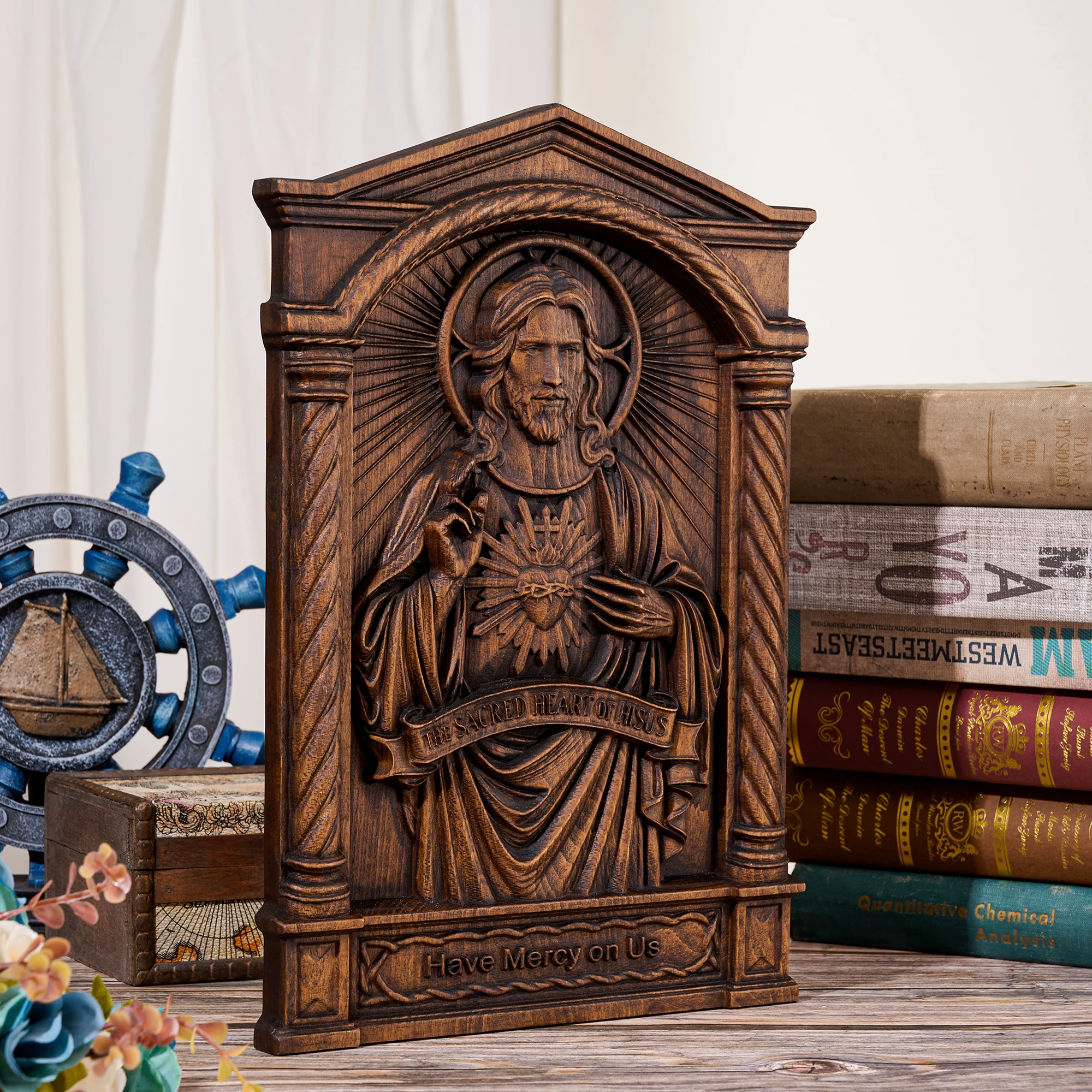 Ebony wood carved plaque featuring the Sacred Heart of Jesus for home decoration. Handcrafted wooden piece with a retro gold fin