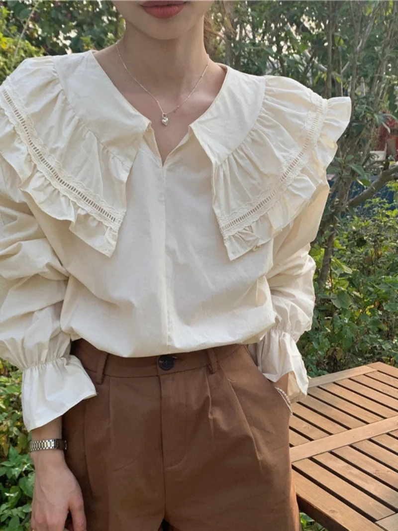 เสื้อแขนยาวทรงหลวมสไตล์เกาหลี คอระบายหวานๆ สำหรับผู้หญิง สีพื้น เหมาะกับฤดูใบไม้ผลิ ดีไซน์เก๋ไก๋ สไตล์ลำลอง แต่งผ้าต่อกัน