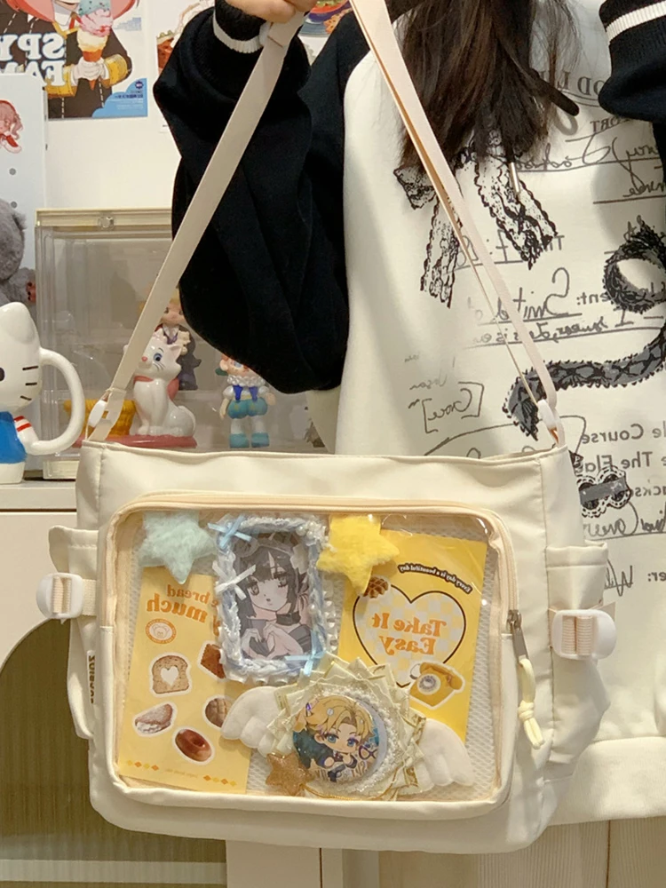 حقيبة Ita النسائية حقيبة كتب كرتونية مع نافذة شفافة للمراهقين حقيبة مدرسية بحزام قابل للتعديل حقيبة كروس أنيقة حقيبة عصرية للاستخدام الخارجي