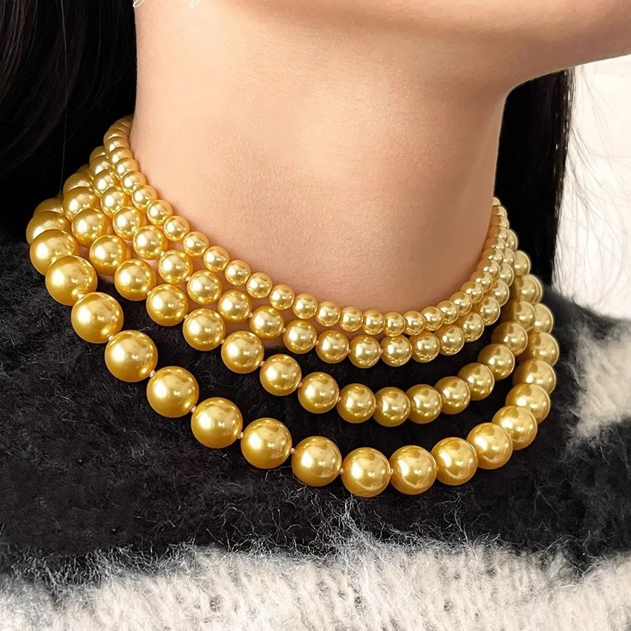 

Ni's same Nanyang old beads Shijia artificial round pearl necklace women's light luxury high-end golden collarbone neck chain