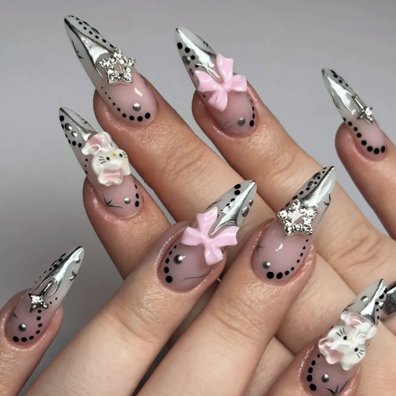 

24pcs Press-On Nails with 3D Pink Bow, Black Polka Dot Border, 3D Cat & Silver Star Charms, Long Almond Shape, Assorted Sizes