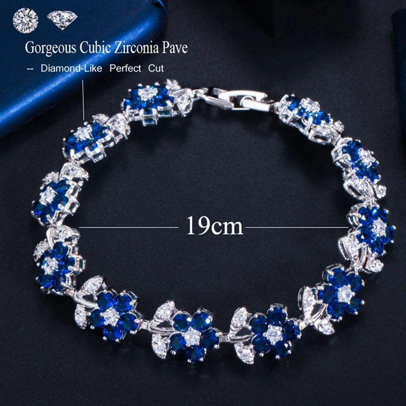 ThreeGraces Beautiful Light Blue Cubic Zirconia Flower Shape Link Chain Bracelet for Women Fashion Daily Party Jewelry BR301