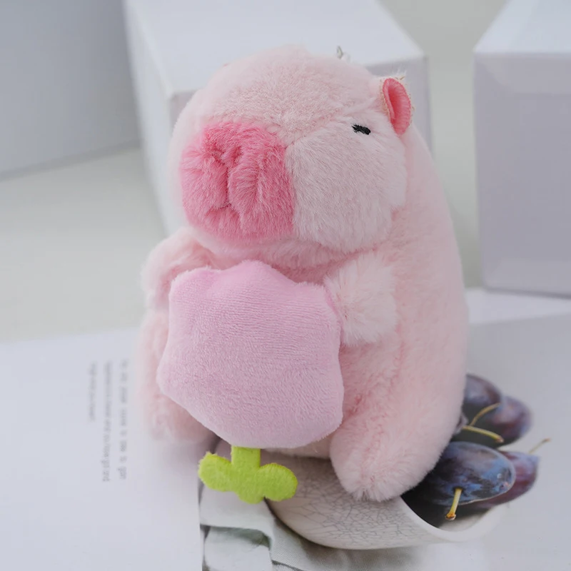 1PC Cartoon Pink capibara con fiori che abbracciano peluche bambola di pezza portachiavi zaino borsa per auto ciondolo Decor Gift