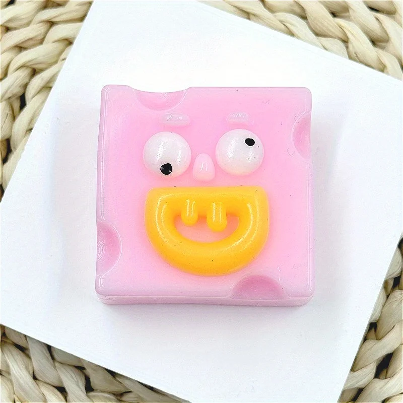Giocattolo da spremere quadrato con bocca di salsiccia eccentrica - Giocattolo di scherzo antistress TPR in rosa, giallo, blu, verde con espressione facciale unica