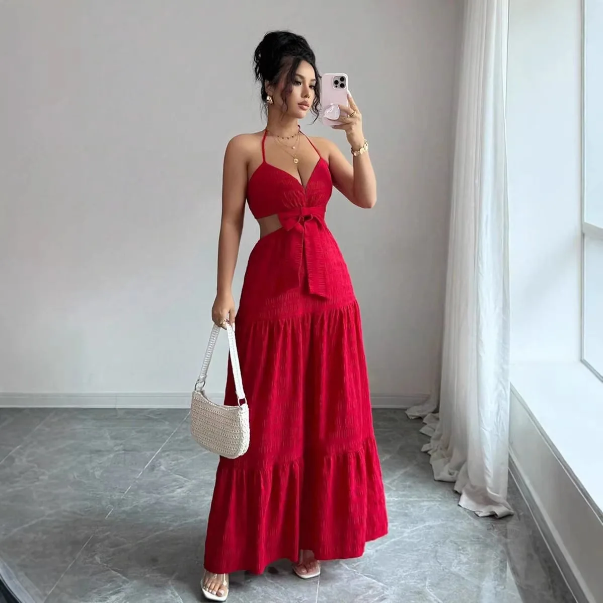 

Elegant women's long dress with camisole straps, waist cinching, V-neck, sleeveless, hollow-out design and bowknot