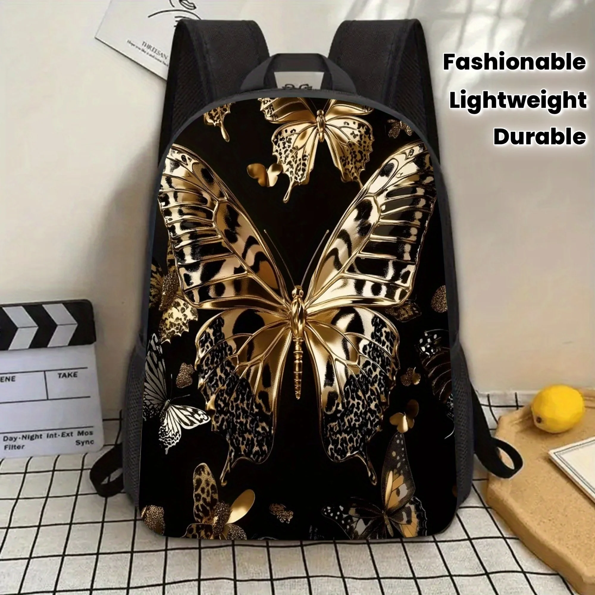 

1 stylish 17-inch butterfly backpack in gold and black design - durable, lightweight, adjustable shoulder straps, laptop