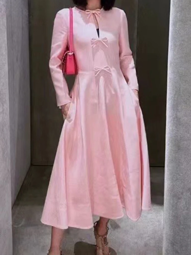 

Retro elegance pink round neck long sleeve bow tie dress 2024 women's autumn new high waist and long A-line skirt.