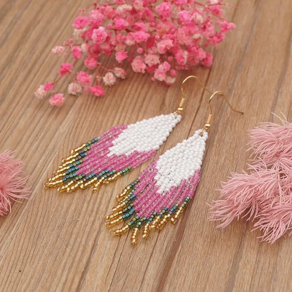 

Rice Bead Earrings Hand knitting Gradient color Bohemia fashion Swallow tail Simple Versatile alloy Fringe Beaded earrings