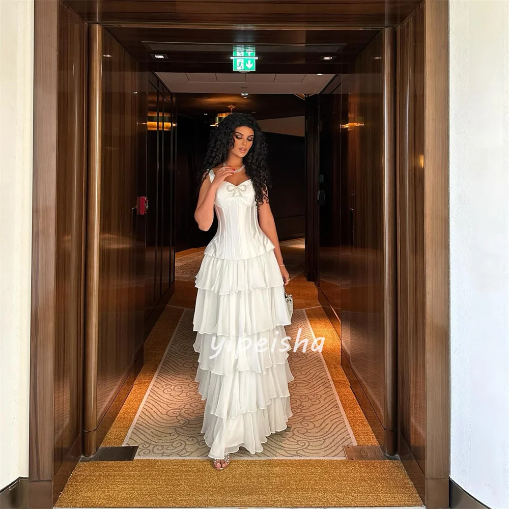 ที่กำหนดเองคุณภาพสูงแฟชั่นชีฟองชั้นไรน์สโตนโบว์ตรงสายรัดปาเก็ตตี้ชุดยาวสั่งทำพิเศษชุดโอกาส