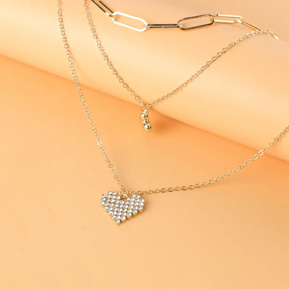 Cross-border fashion multi-layer necklace, European and American retro alloy diamond-encrusted heart-shaped pendant, snake bone