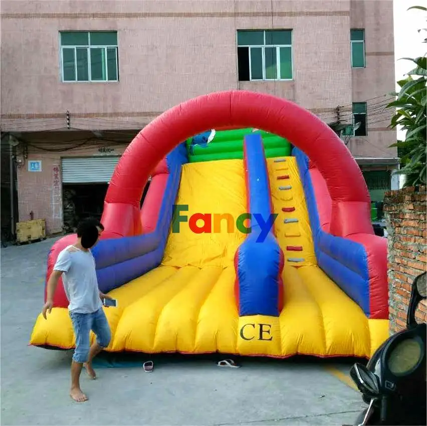 Commercial tiktok bouncy castle/inflatable climbing wall with slide/inflatable climbing wall with slide for kids on sale