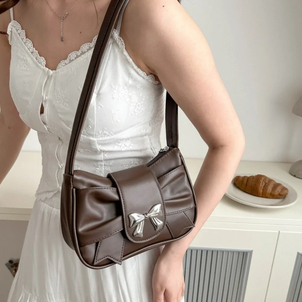 Hoge kwaliteit PU-leer vierkante geplooide handtas Zachte mode Boog okseltas Onderarm waterdichte strik Crossbody tas Meisjes