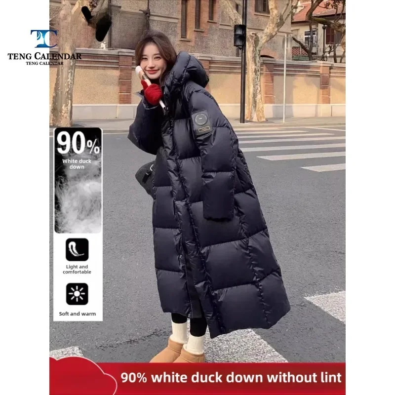 Chaqueta larga de plumón negra y dorada, chaqueta gruesa y cálida con capucha y plumón de pato hasta la rodilla, nuevo modelo de invierno 2024 para mujer