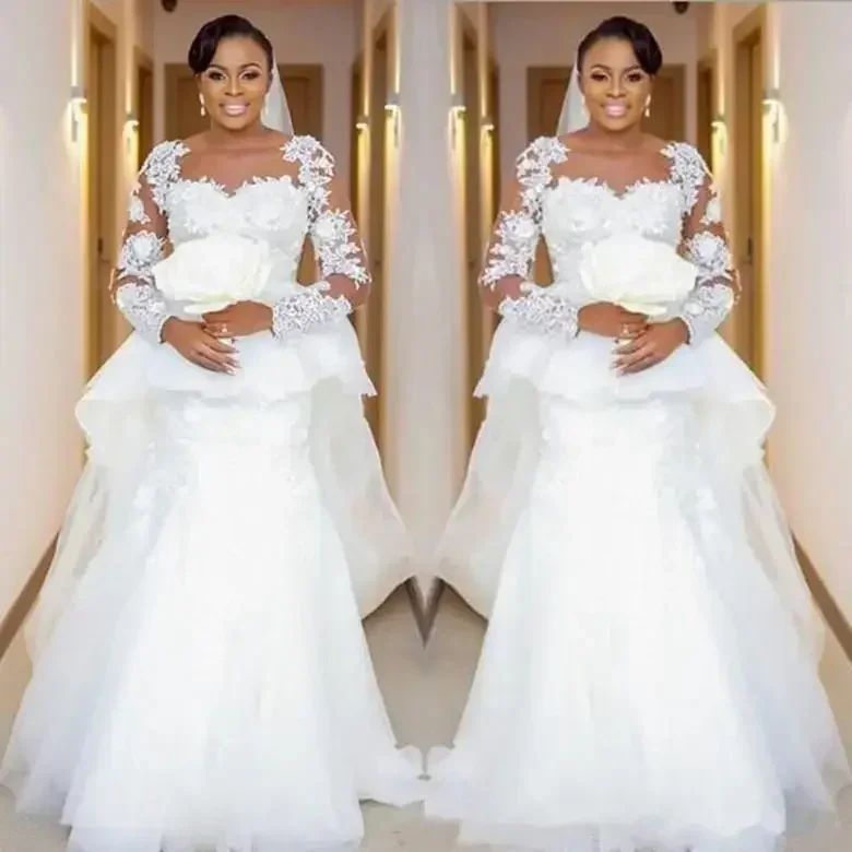 Maßgeschneiderte afrikanische Meerjungfrau-Brautkleider in Übergröße, Juwelenausschnitt, Spitze, Applikationen, Perlen, lange Ärmel, Schößchen, Sweep-Zug, Dubai Brida