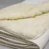 

100% natural, washable and reversible wool filled mattress pad, 1in thick.