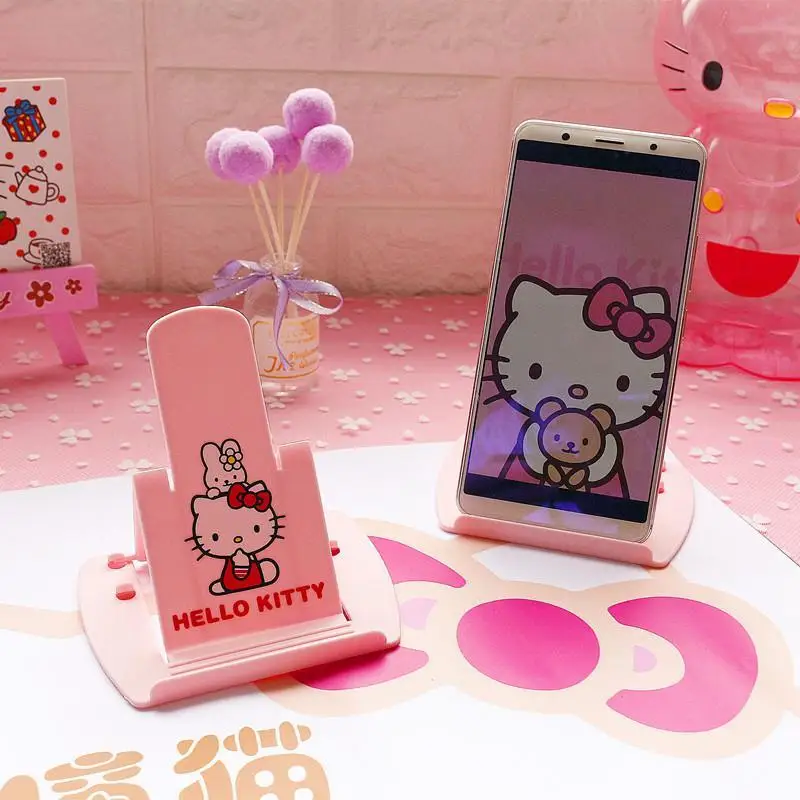 

Hello Kitty Kawaii Sanrio Anime Kuromi Mobile Phone Holder Cute Cartoon My Melody Foldable Phone Stand Lovely Toys for Girls