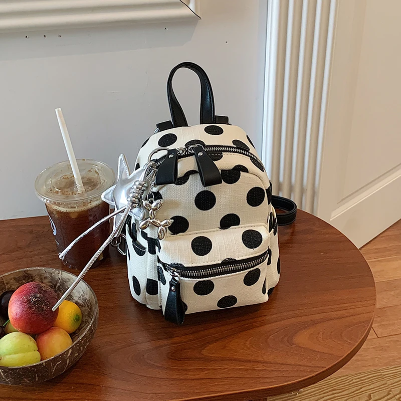 coach elle backpack white Disney X With Dalmatian Floral Print The Ella Shoulder Bag works well for daily plans and evenings out White Elle Backpack In Signature