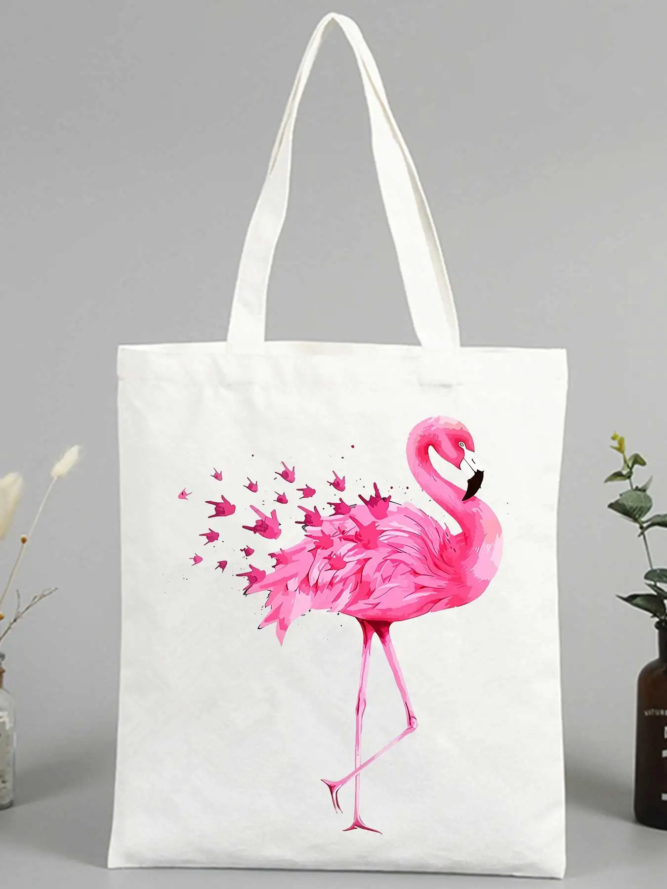 Women's canvas tote bag with pink flamingo print, artistic design ideal for casual shopping and summer outings