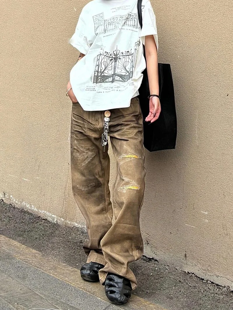 American High Street Design Ripped Micro Flared Denim Jeans Men Women 2026 New Vintage Oil Stained Floor-Length Pants