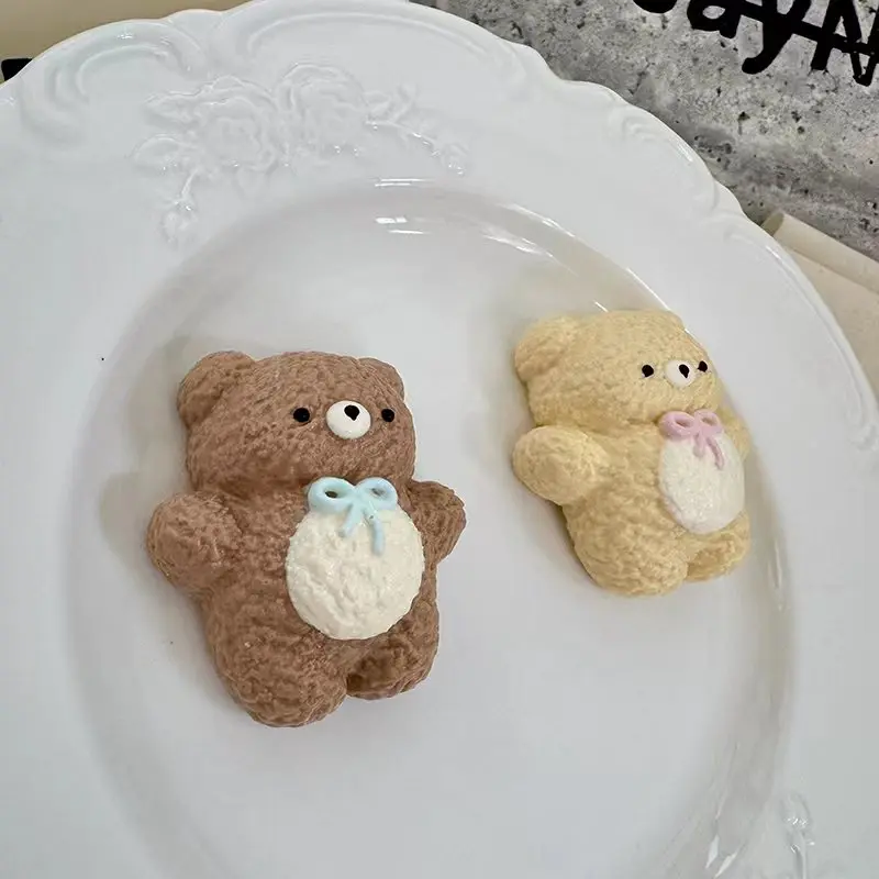Slow-rebound bow-tie bear squeeze toy available in two colors; its compact size makes it cute and convenient to carry around.