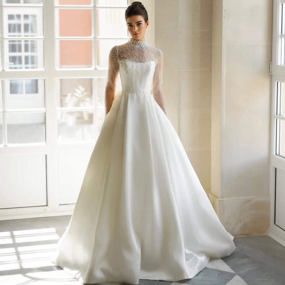 

Elegant Bride High Neck Wedding Dress Pearl Tulle Long Sleeve and Satin A-Line Floor Length Customized with Bow Button Gowns