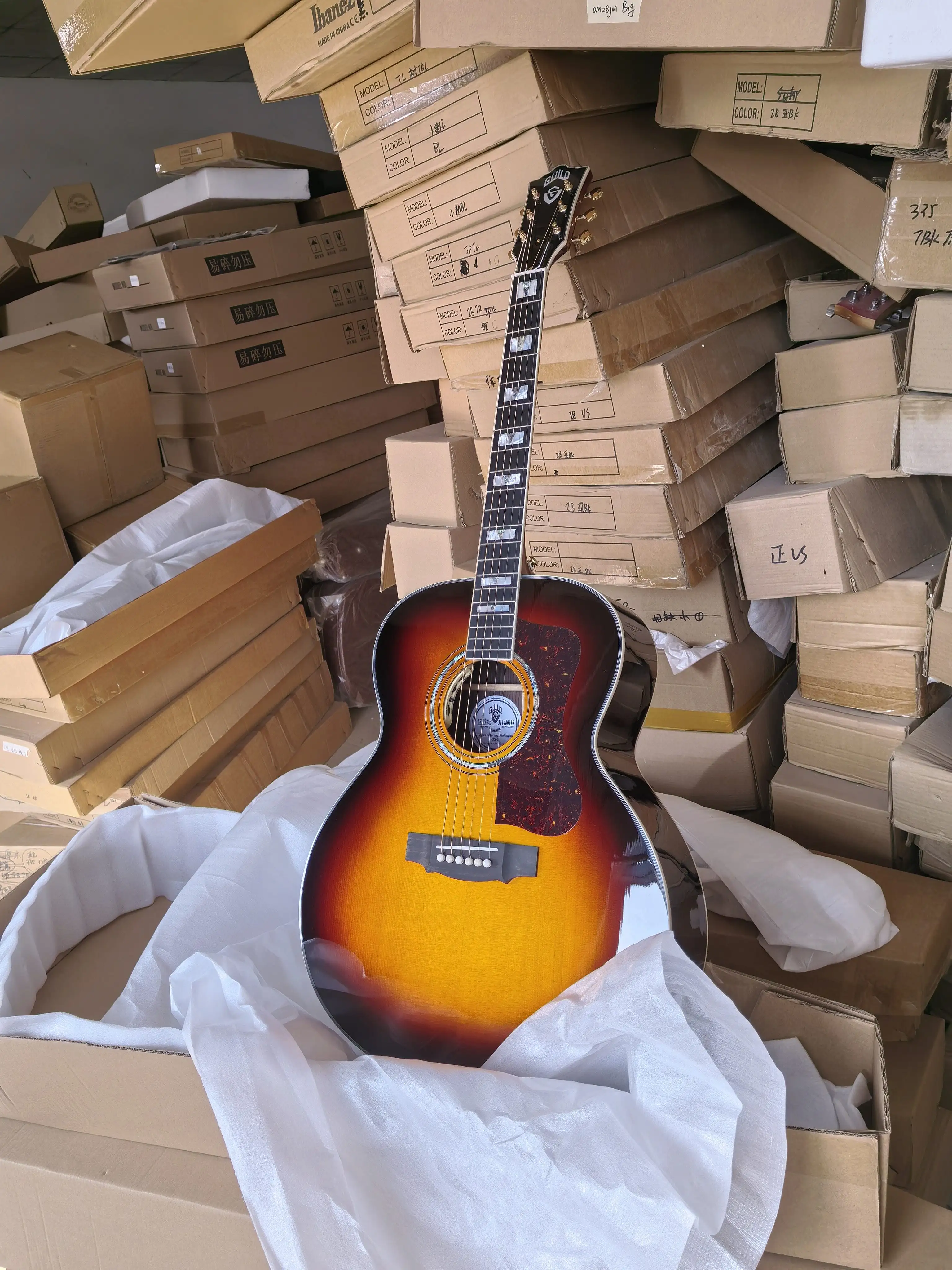 

all solid wood handmade Guild guitar with soundhole pickups. best pearl inlay with best wood jumbo guitar