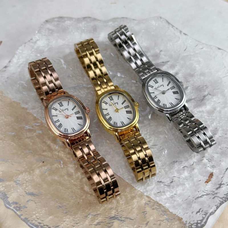 

Модные женские наручные часы с римским циферблатом, стальной ремешок, кварцевые часы, универсальный овальный циферблат, золотой браслет, женские часы, подарки