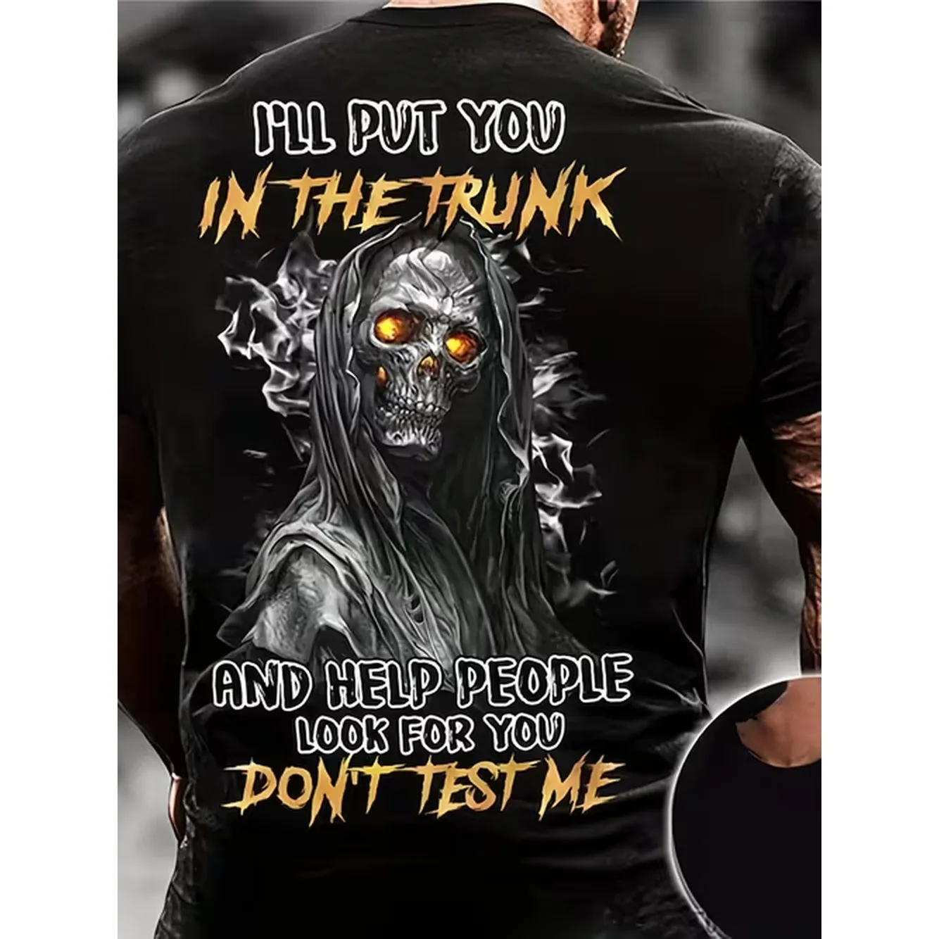Ill Put You Black T Shirt Featuring A Muscular Cut Pattern And A Quirky Skull Design With Glowing Orange Eyes With White And Metallic Yellow Text Fans Who Love Dark And Intimidating Styles Halloween Parties Or Making
